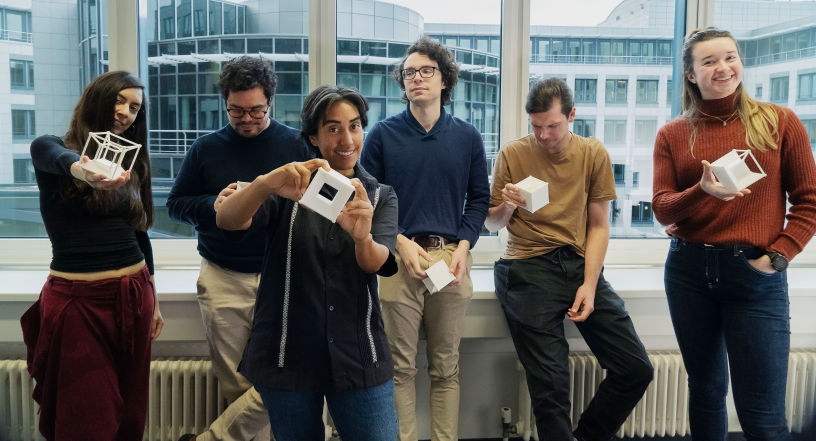 In this group of Mathematicians integrated by members of ScaDS AI and the Max Planck institute pose in front of the camera showing a cheerful image of this group of researchers.