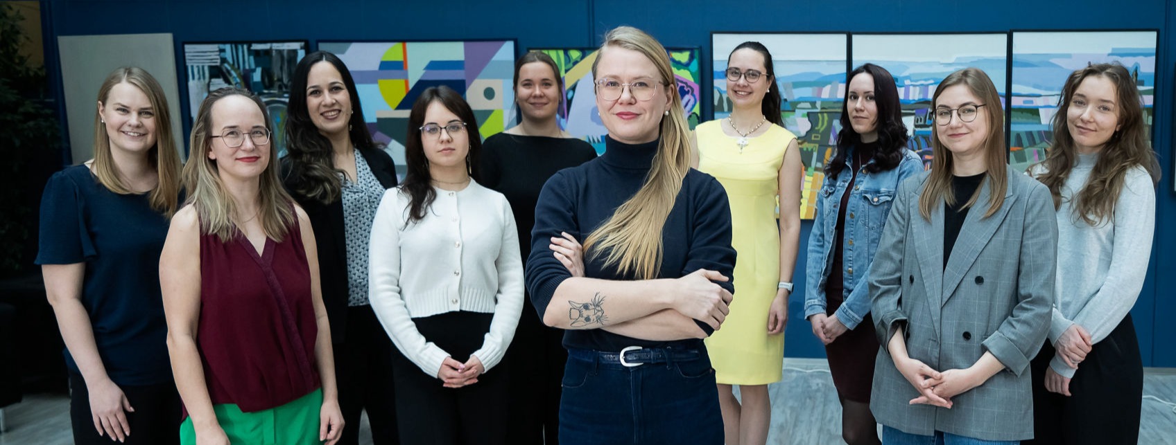 A group of researchers at the genomics institute of the University of Tartu pose in front of the camera to capture an epic group photo.